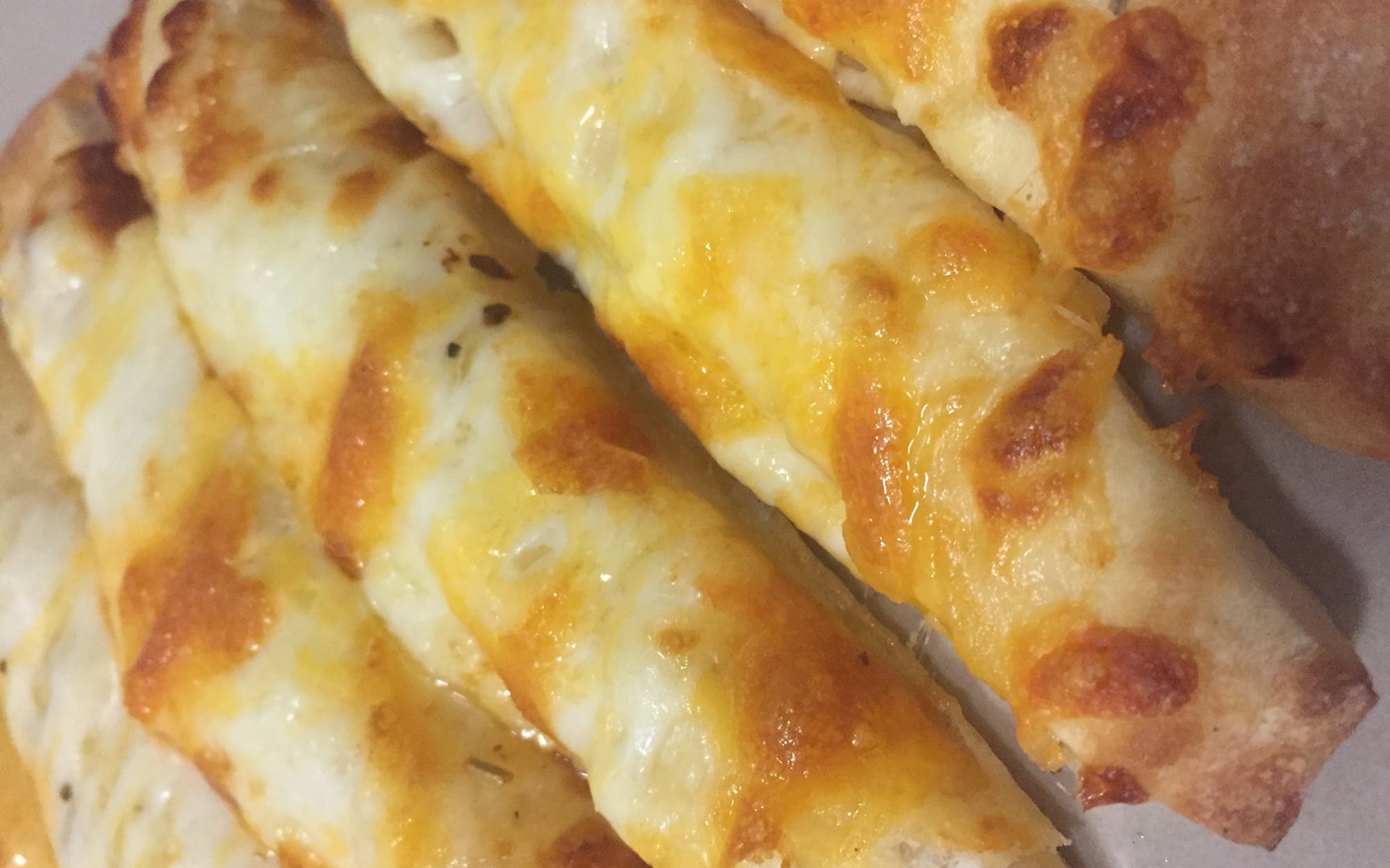 Sticks of fluffy bread with cheese. Great as a snack or for dipping with marinara sauce! (8)