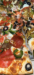 A slice of Bronx Pizza with up to 4 toppings for $4.  Fits in an 8x8 pizza box.