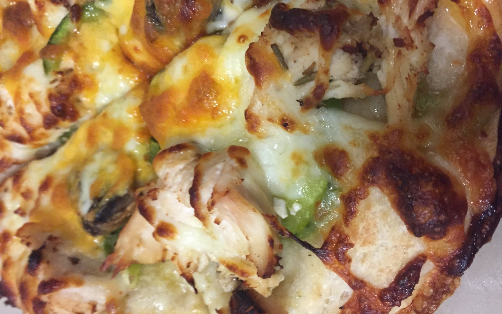 Fresh Mushrooms, Onions, Mozzarella Cheese, Chicken, Garlic Sauce, Cheddar Cheese and Green Peppers