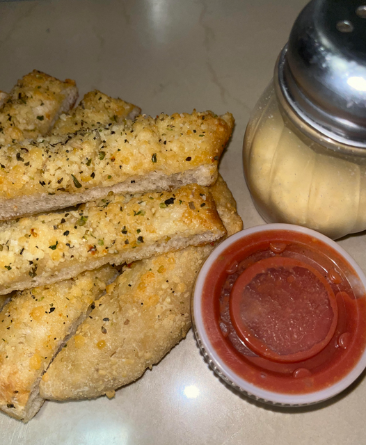 Seasoned Parmesan Garlic Bread (8) served with marinara sauce.